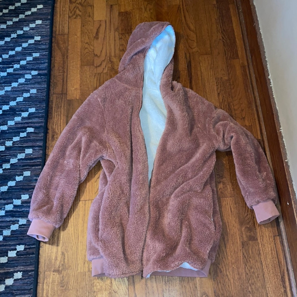 Size Large sharps jacket zips all the way up to hood